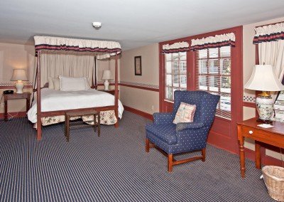 Room with four post bed and balcony